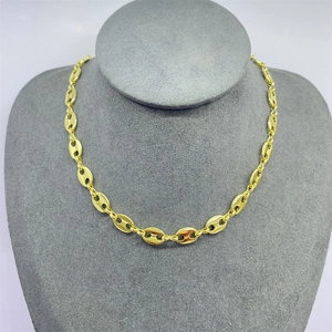 Polished golden coffee bean link chain necklace displayed on a professional grey neck model
