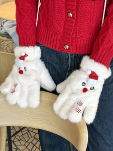 Detail of plush snowman gloves with red mini hats and soft faux fur texture