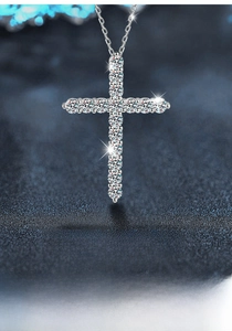 Close-up of S925 sterling silver cross pendant necklace with moissanite pavé stones