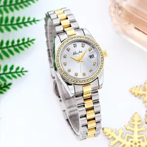 Luxury quartz women watch with bicolor steel band and crystal bezel on elegant background