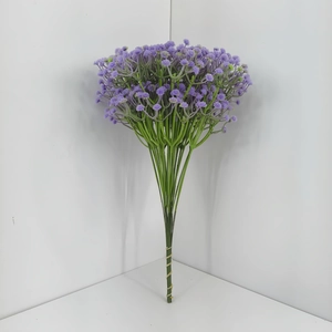 Close-up of a bundle of purple artificial gypsophila flowers with green plastic stems