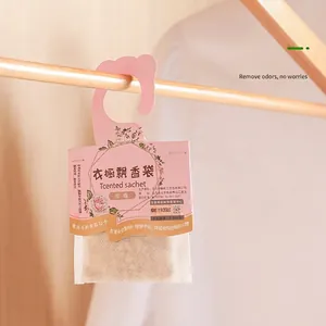 Hanging rose scented sachet for wardrobe featuring aromatic particles and hook