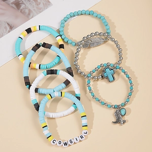 Detail of 7-piece bohemian bracelets with turquoise beads, feather and cross charms