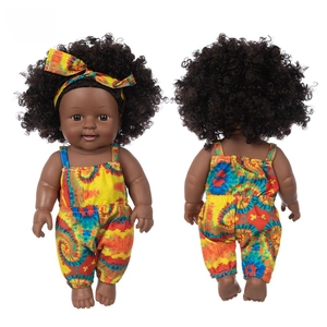 Front and back detail of 12-inch African baby doll in colorful tie-dye romper and headband