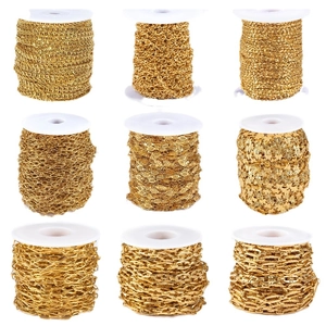 Nine styles of gold plated stainless steel oval chains wrapped on white plastic spools