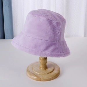 Detailed close-up of the plush purple bucket hat texture on a wooden stand