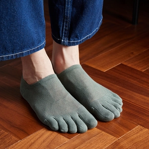 Detail of men's five-toe socks with breathable mesh texture in greyish green