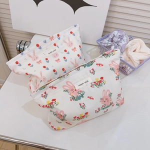 Fresh rabbit pattern canvas makeup organizers with zipper closure on a white desk