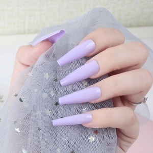 Glossy lavender extra-long ballerina press-on nails shown on a model hand with mesh