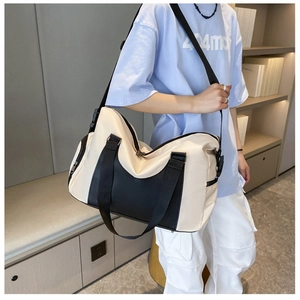 Modern gym bag with wet dry separation shown being worn by a model in a minimal room