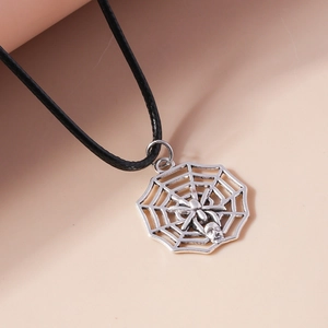 Detailed close-up of a silver spider web pendant with a spider charm on a black cord