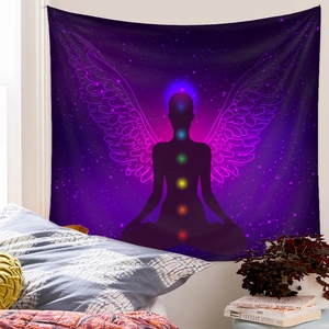 Detailed view of purple meditation tapestry with chakra silhouette in a cozy bedroom setting