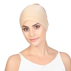 Detailed view of beige pleated headscarf cap for women with elegant soft fabric texture