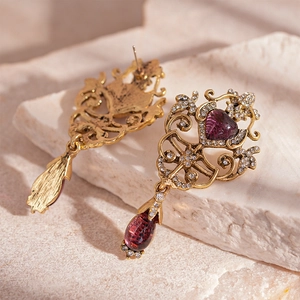 Vintage gold filigree earrings with purple heart stones and teardrop crystal pendants