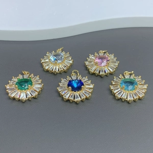 Detail of sunflower crystal pendants with colorful gemstones and zircon halo clusters