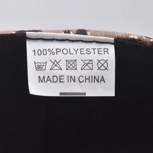 Detail of product care label showing 100% polyester fabric and made in China text