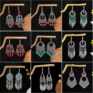 Boucles D'Oreilles Pendantes Ethniques Bohèmes Vintage Plume Alliage Creux Bijoux À Franges Avec Tige En Acier Inoxydable Pour Femmes