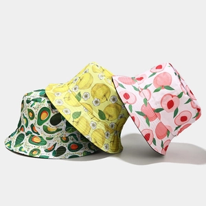 Reversible bucket hats featuring avocado, lemon and peach prints for sun protection
