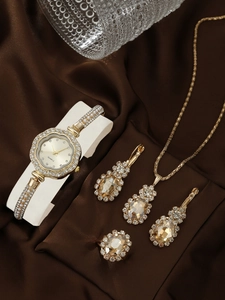 Detailed set of gold quartz watch, necklace, earrings, and ring with sparkling rhinestones