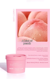 Detailed close-up of peach fragrance gel jar showing top peach graphics and scent notes