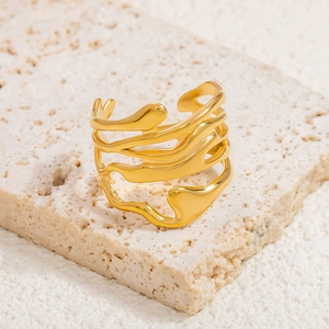 Detailed view of 18k gold plated stainless steel multi-layer wave ring on stone