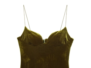 Detail of dark green velvet camisole dress featuring thin straps and a sweetheart neckline