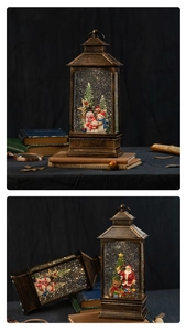 Close-up of vintage bronze Christmas snow globe with Santa and warm LED lighting detail