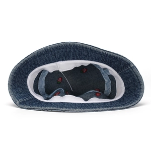 Inside view of a navy denim bucket hat with red strawberry embroidery and sweatband