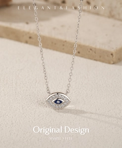 Macro detail of S925 sterling silver evil eye pendant necklace with blue zircon stones
