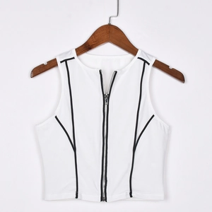 Detail of white crop top with front zipper and black contrast piping on hangers