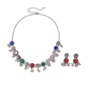 Vintage silver flower necklace with colorful rhinestones and hanging tassels on white background