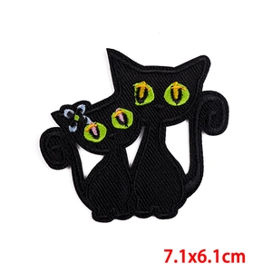 Embroidered black cat patch with green eyes and blue flower for kids clothing 7.1x6.1cm