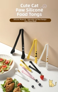 Various colorful cat paw silicone food tongs shown with bread and snacks on a table