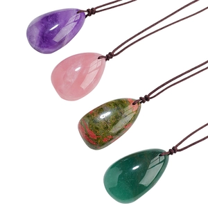 Natural teardrop crystal pendants in purple, pink, and green on brown cord necklaces