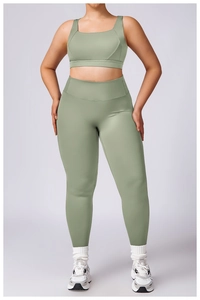 Detail of high-stretch sage green plus size sports bra and high-waist yoga leggings