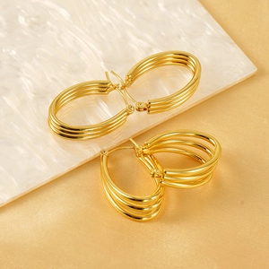 18k gold plated multi-layer stainless steel hoop earrings on marble display