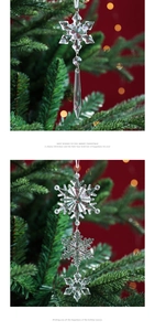 Close-up of clear acrylic snowflake and icicle pendants hanging on a Christmas tree