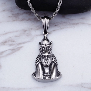 Macro shot of silver stainless steel Egyptian pharaoh pendant with twisted rope chain