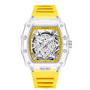 Detail of tonneau mechanical watch with skeleton dial and vibrant yellow silicone strap