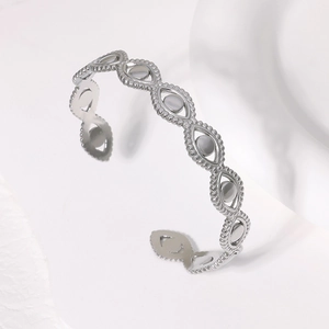 Bracciale rigido aperto con malocchio in acciaio inossidabile argento e decori granulati