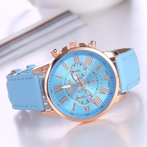 Detail view of the sky blue watch face with Roman numerals and decorative subdials