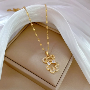 Luxurious gold teddy bear necklace with sparkling zircons and flat textured chain