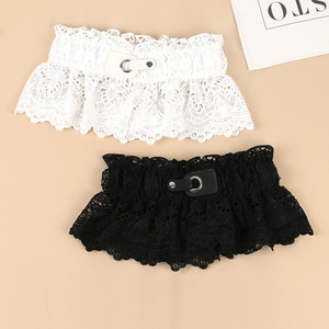 Detailed view of elastic lace corset belts in black and white with metal buckle details