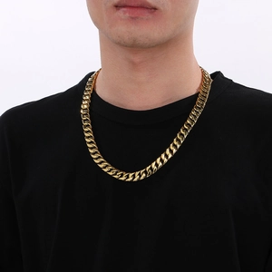 Close-up of 12mm gold-plated stainless steel Cuban link necklace for men on neck