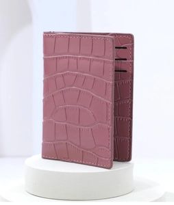 Close-up of pink crocodile pattern card holder wallet with multiple interior slots