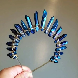 Detailed view of dark blue electroplated crystal pillars hand-woven onto a golden wire crown