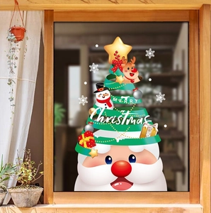Festive window stickers featuring Santa, snowman and Merry Christmas text on glass