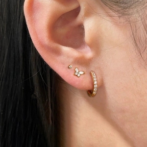 Three-piece gold plated earring set with butterfly stud and micro zircon hoops on ear