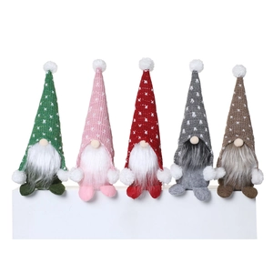 Five assorted Christmas faceless gnomes with colorful knit hats and white faux fur beards