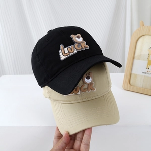 Kids baseball caps in black and khaki with cartoon bear and LUCK letter embroidery